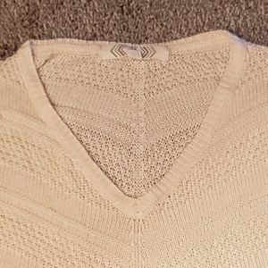 Cream colored ribbed sweater size medium.